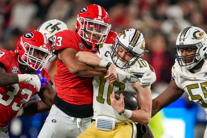 Nov 25, 2023; Atlanta, Georgia, USA; Georgia Bulldogs defensive lineman Tyrion Ingram-Dawkins (93) tackles Georgia Tech Yellow Jackets quarterback Haynes King (10) during the second half at Hyundai Field. Mandatory Credit: Dale Zanine-USA TODAY Sports